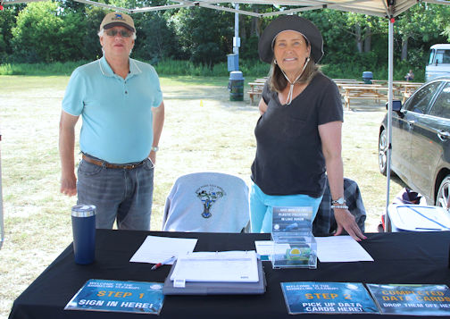 Huron Bruce Nature members Steve Pepper (left) and Catherine Hodges register the volunteers and give them instructions|
