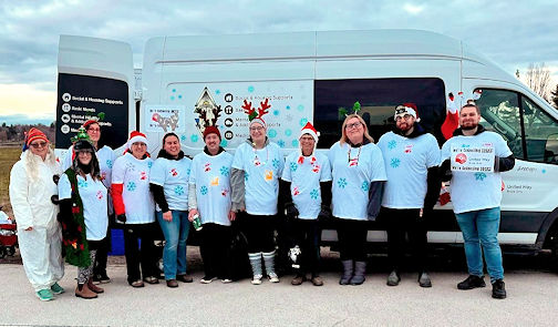 ​United Way collecting warm socks at local Santa Claus Parades