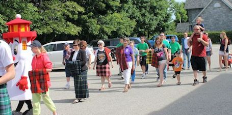 Piping of the Tartan parade marches through downtown Kincardine Saturday morning