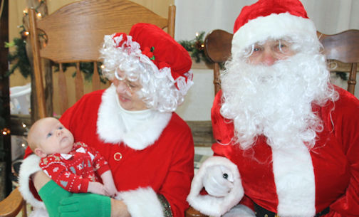 ​Children visit with Santa and Mrs. Claus at Ripley Christmas Celebration