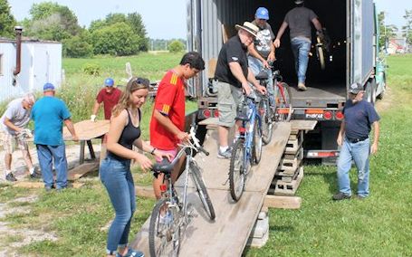 District Lions load up almost 500 bikes to ship to Cape Town, South Africa